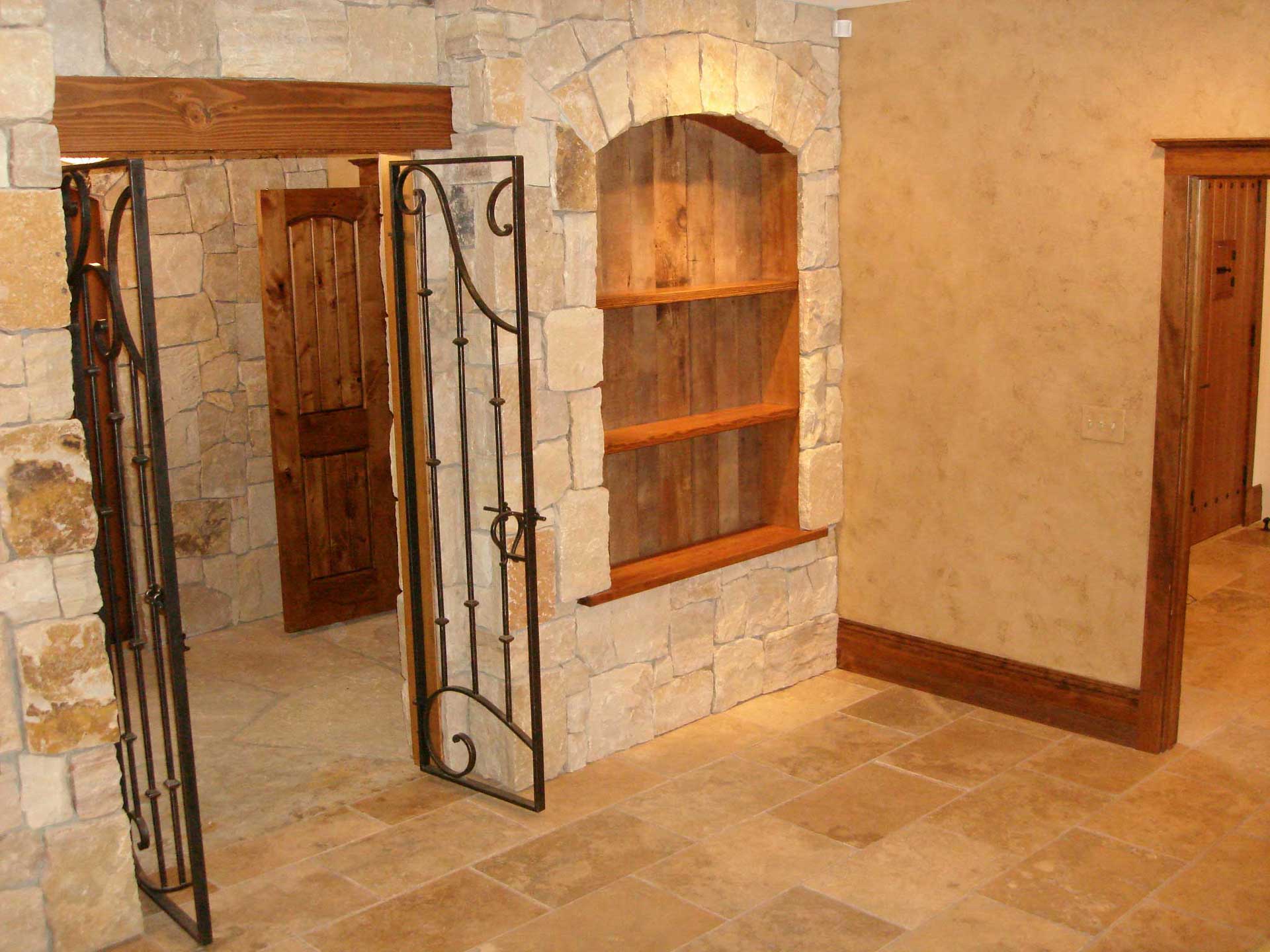 Photo of Brauner project, Iron gate in stone wall.