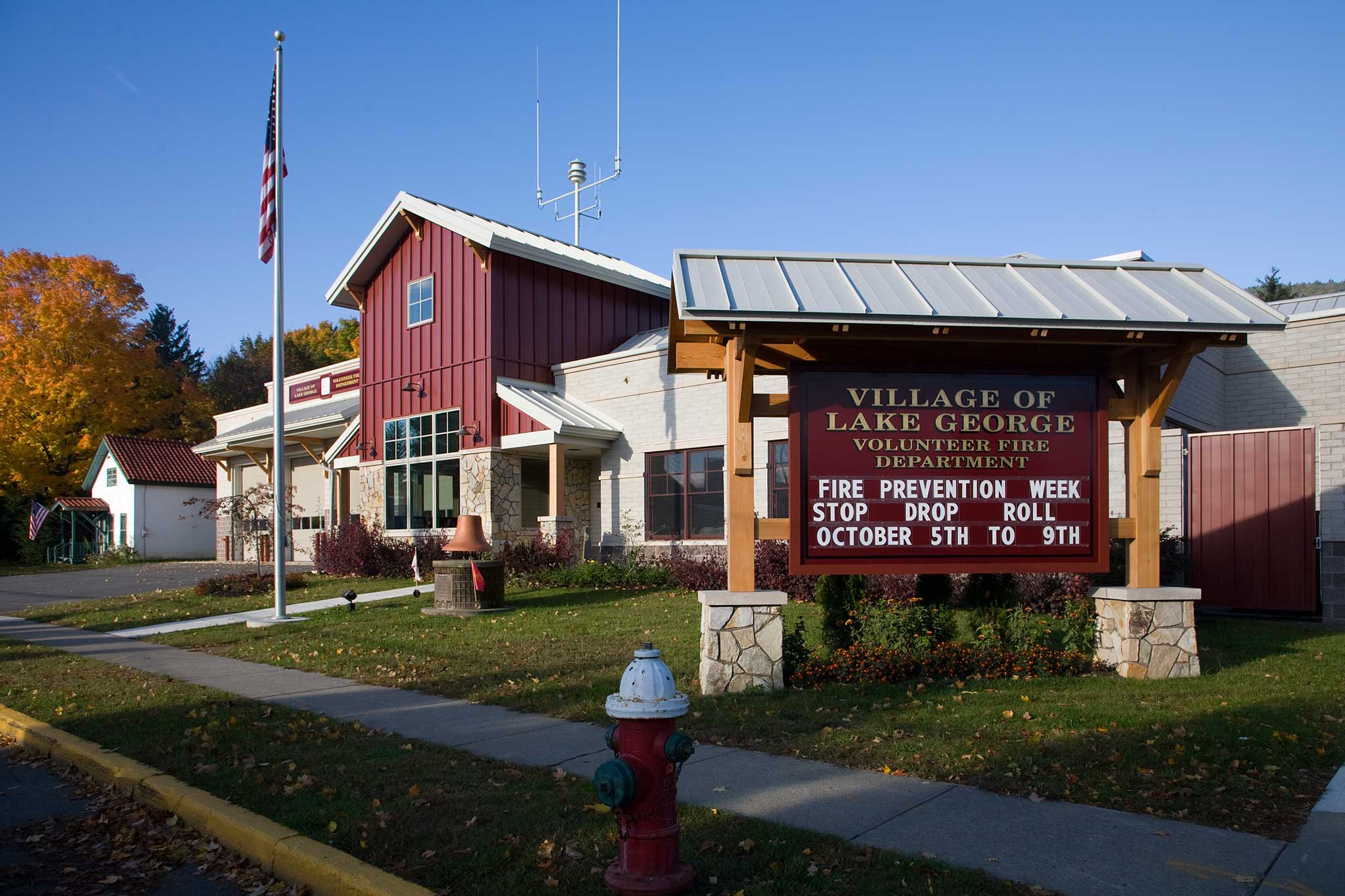 Photo of Lake George Fire House with Sign in foreground